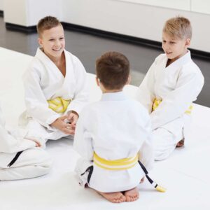 Children learning discipline and confidence in a kids martial arts class
