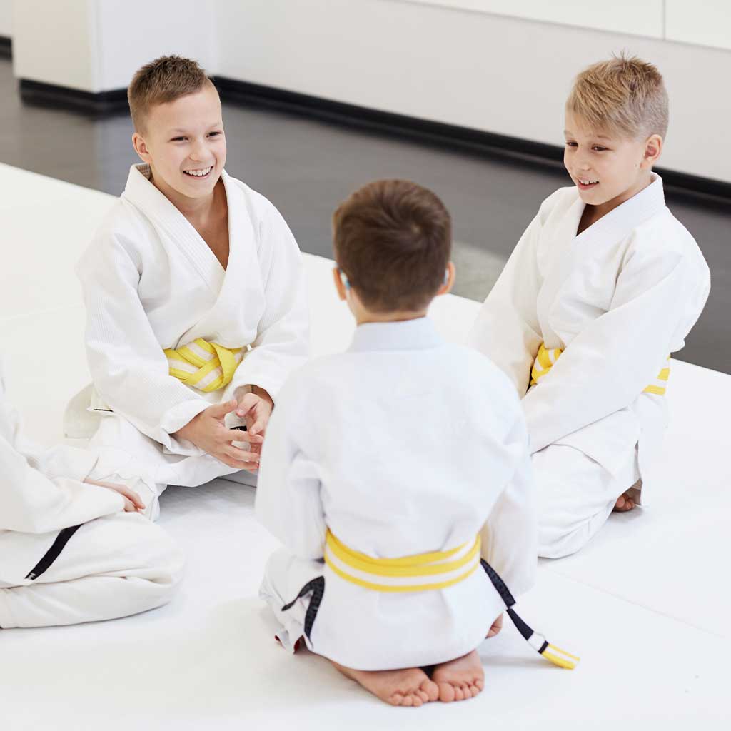 Children learning discipline and confidence in a kids martial arts class